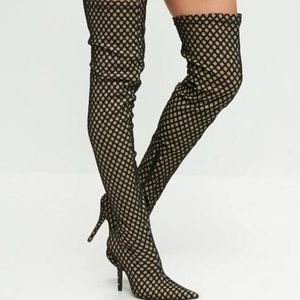 Over the knee fishnet boots